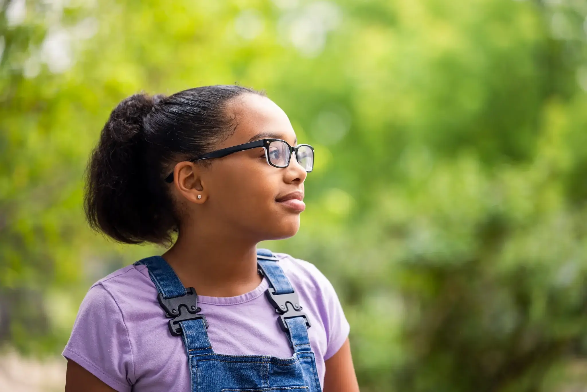 A student looking ahead outdoors